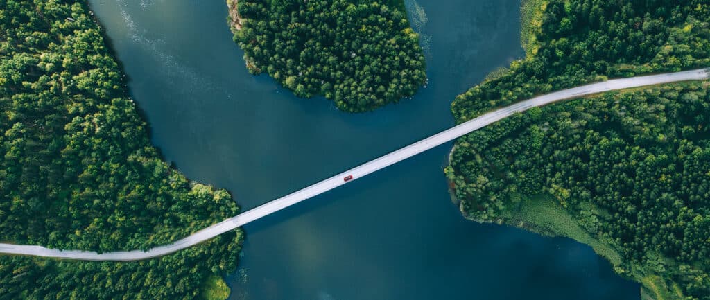 Arial shot of a bridge over a river.